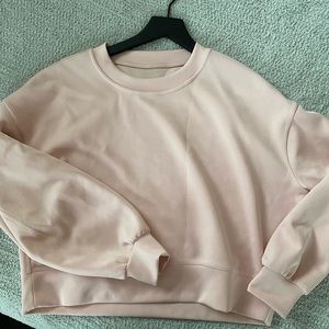 Women’s Lululemon Perfectly Oversized Crop Crew. Size 6. It is light pink.